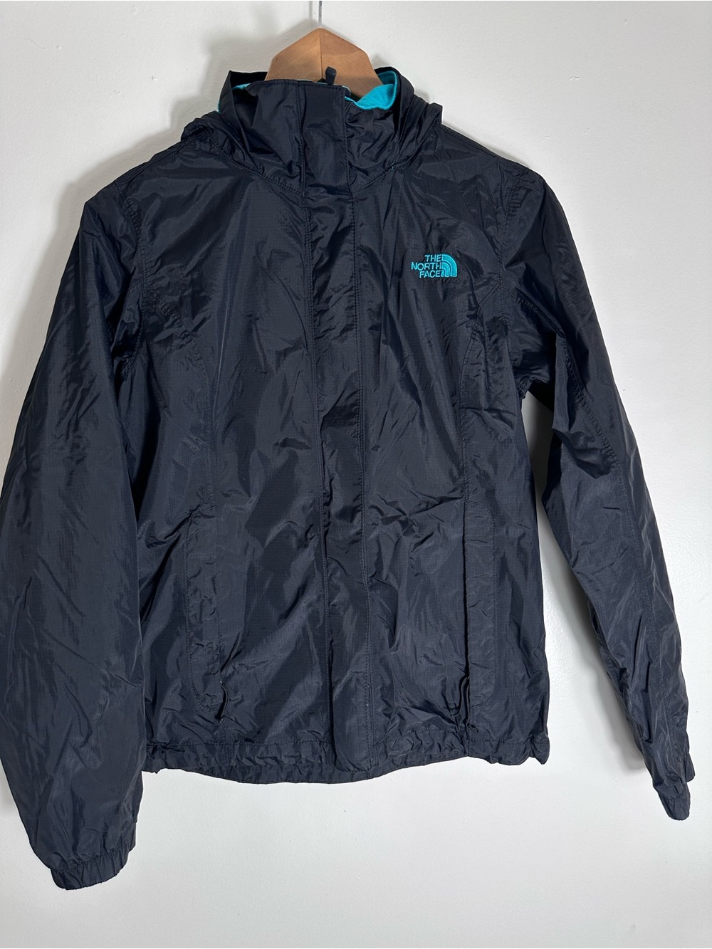 The North Face Black Hooded Raincoat with Teal Logo Accent